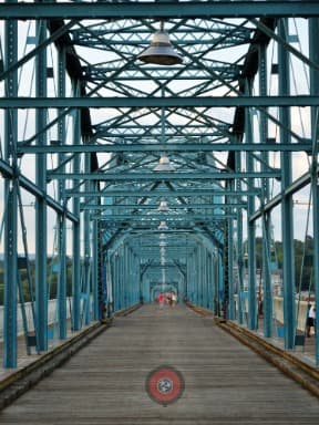 Chattanooga riverfront skyline and pedestrian bridge at dusk